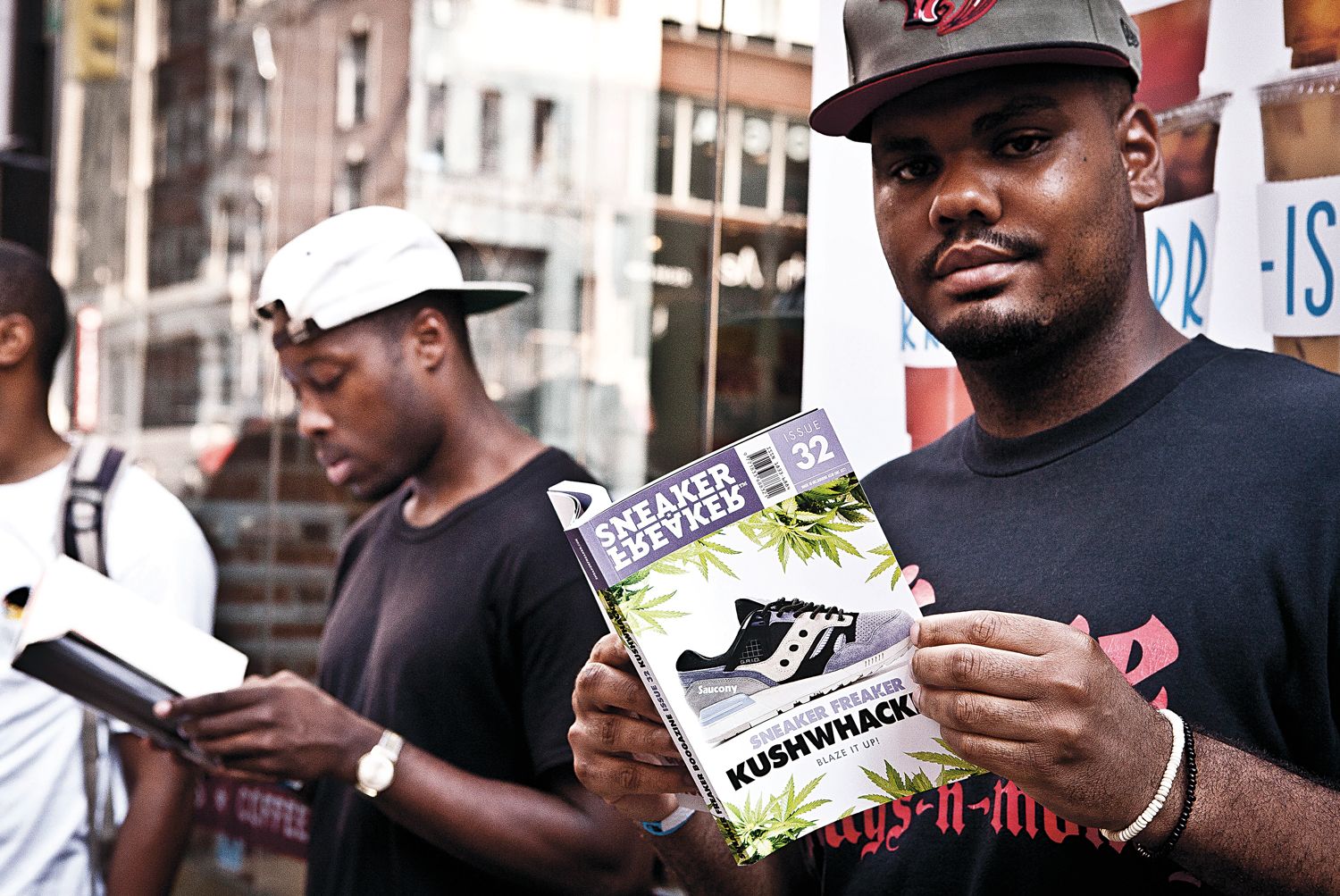 Man reading Sneaker Freaker Issue 32 at the SF x Packer x PUMA Bloodbath launch